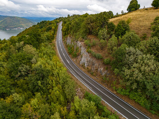 Scenic road winding through lush greenery in Djerdap National Park on the Serbia Romania border