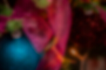 Blurred Christmas background. Defocused abstraction for Xmas. Blur backdrop of New Year 2026. Abstract background with nobody. Defocused blur colorful Christmas. Xmas party. Blurry Christmas lights