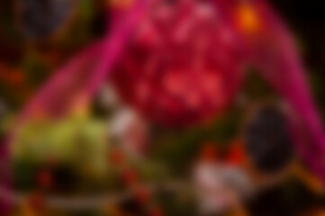 Blurred Christmas background. Defocused abstraction for Xmas. Blur backdrop of New Year 2026. Abstract background with nobody. Defocused blur colorful Christmas. Xmas party. Golden bokeh glow