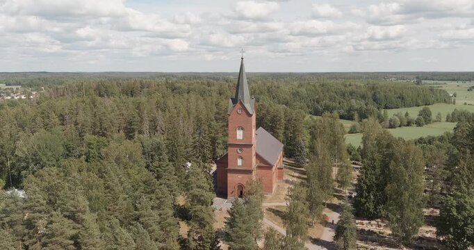 Aerial view of M&auml;nts&auml;l&auml; church, which is a longitudinal church with a western tower in summer, M&auml;nts&auml;l&auml;, Finland.