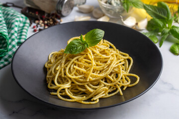 Spaghetti pasta with pesto sauce