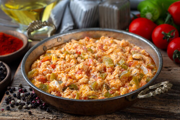 Turkish traditional menemen dish made with eggs, peppers and tomatoes