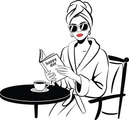 Woman wearing robe and turban reading book with coffee sunglasses.