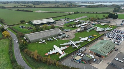 Aerial drone view of historic aircraft museum, world war two war planes in green landscape near Newark UK