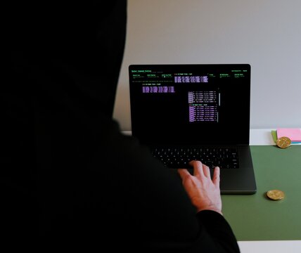 Hacker in Black Hoodie Running Multiple Terminals from Hacker Command Station Software - Hacktivist Concept of Man Representing US and China