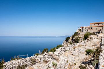 Wonderful stone houses , in the village of Lubenice, rising above blue Adriatic sea at the island of Cres, Croatia