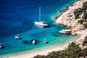 Amazing Lubenice beach, almost only accessible by the sea, with its turquoise waters and sand shore, below steep slopes of Cres island, Croatia