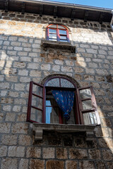 Beautiful, old windows on the stone house in the town of Cres, Croatia