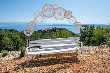 Lovely white bench and frame on the viewpoint above village of Beli on Cres island, Croatia