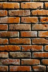 Red brick wall with textured surface relief. Brickwork close-up, natural rough background