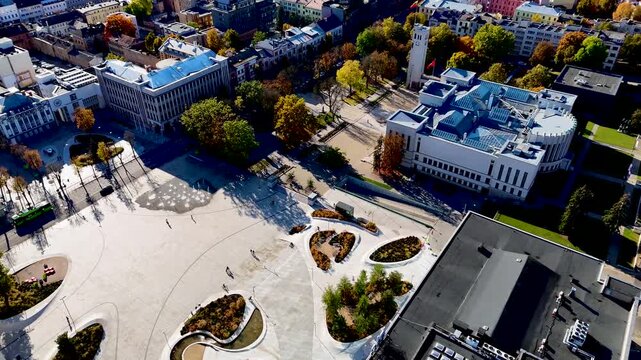 Unity square and Business leaders center in city center of Kaunas in autumn. Aerial drone 4K video footage of one of the newest and most modern squares in Europe.