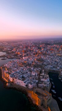 Breathtaking drone footage of Monopoli, Puglia during a golden sunset.