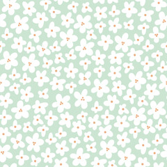 Seamless vector floral pattern with tiny white blossoms on soft mint green background. Minimal hand-drawn illustration perfect for spring textiles, baby clothing, gift wrap and modern home decor desig