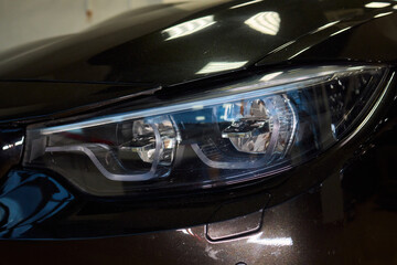 Close up of a cars headlight, part of automotive design