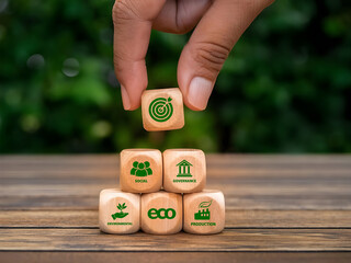 ESG target Environmental, Social, and Governance, representing sustainable business strategy and corporate responsibility, iso environmental. Hand placing a wooden block with ESG icon.