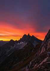Vibrant alpenglow bathes rugged, isolated peaks in warm, dramatic colors during a remote mountain sunset ,dusk ,contrast ,remote