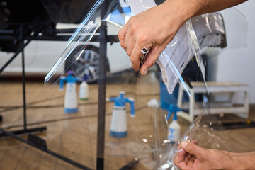 Applying a Protective Film on the Surface of Your Car for Enhanced Durability and Shine