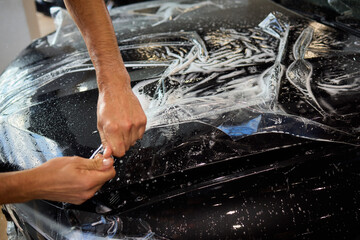 Applying a Protective Film on the Surface of Your Car for Enhanced Durability and Shine
