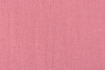 Pink fabric texture macro photo as background.