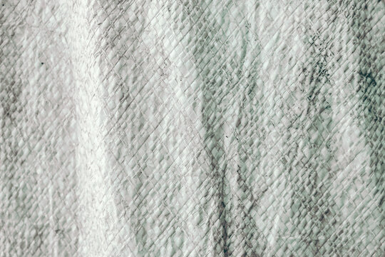 grayish white woven plastic sack texture