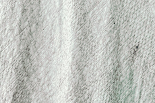 grayish white woven plastic sack texture