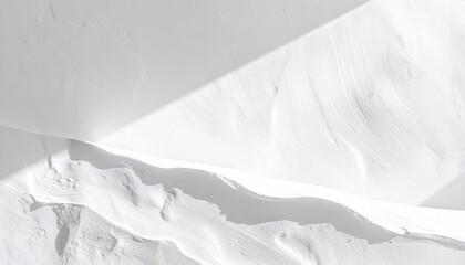 Macro View of Textured White Surface with Dramatic Top Down Lighting and Shadow Play Revealing Subtle Ripples and Geometric Shapes