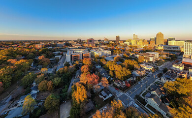 Obraz premium Aerial Drone Images of Downtown Raleigh North Carolina Skyline at Golden Hour: Travel, Architecture, Cityscape, Business, Real Estate