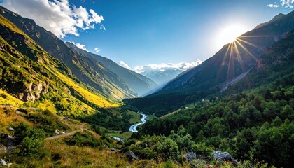 Golden Sunbeams Illuminate Lush Green Mountain Valley With Winding River And Rocky Trail Under Blue Sky