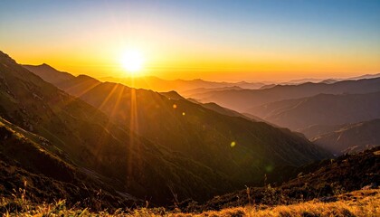 Golden Sunrays Bursting Over Mountain Ranges at Sunrise With Warm Light and Golden Hour Glow Creating Dramatic Shadows and Highlights On Rolling Hills With Dry Grass In The Foreground
