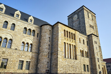 A magnificent stone imperial castle with a clock tower in Pozna