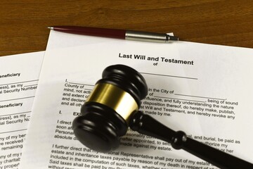 Last will and testament with judges gavel. Inheritance after the deceased.