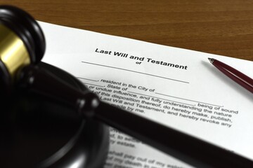 Last will and testament with judges gavel. Inheritance after the deceased.