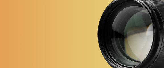 Camera lens on orange gradient background, closeup. Banner design with space for text