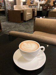A Quiet Moment – Enjoying a Cup of Café Latte in the Lounge