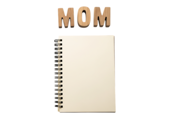 Wooden letters spelling mom above a blank notebook isolated on transparent background