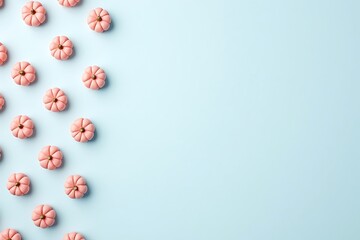 Pastel pink pumpkins on blue background fall autumn halloween thanksgiving seasonal flat lay top view aesthetic