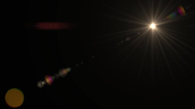 Stylish lens flare effect on dark background radiating vibrant light, perfect for transitions, overlays, and creative motion graphics elements adding a touch of magic and visual flair