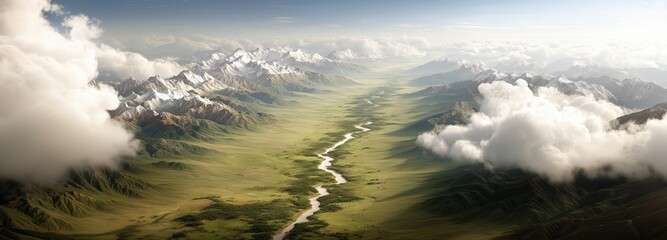 Aerial view of a serene river valley amidst snow-capped mountains
