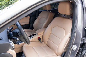 Photograph of the interior of a modern vehicle with leather seats