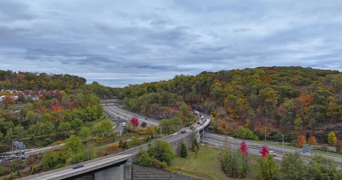 Fall afternoon aerial hyper lapse video over Interstate 87, 287,  Elmsford, NY in Westchester County.