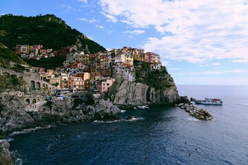 Manarola village in Cinque Terre, Italy, colorful cliffside houses and Mediterranean Sea