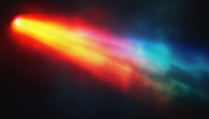 Bright multicolored comet streaking through a dark starry sky with vibrant hues of red, yellow, purple, and blue trailing behind a glowing head