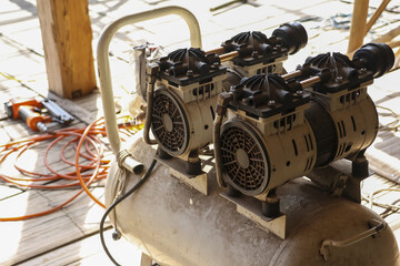 Powerful industrial air compressor machine with heavy duty equipment on construction worksite....