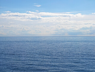 Calm blue sea surface, sky and horizon. Ligurian Sea in Italy