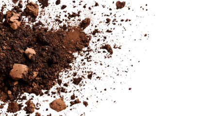 Close-up of scattered brown soil, earth tones against a black background