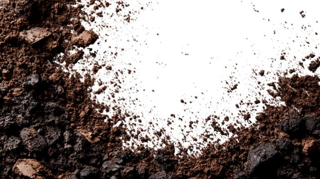Close-up view of dark soil and gravel with a black void