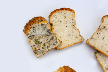 Sliced multigrain bread topped with pumpkin seeds, sunflower seeds, sesame, and black sesame.