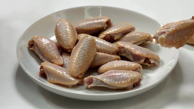 Serving of Poultry Appetizers Arranged on a Plain White