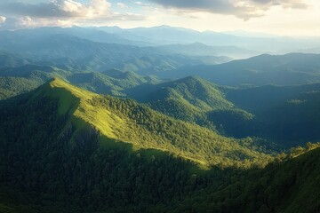 Naklejka premium Sunlit green forested mountain ridge with layers of distant blue mountains under a partly cloudy sky creating a peaceful natural landscape