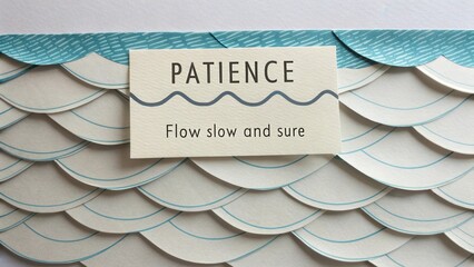 Inspirational paper art featuring the word patience with elegant wave patterns for mindful decor or crafts